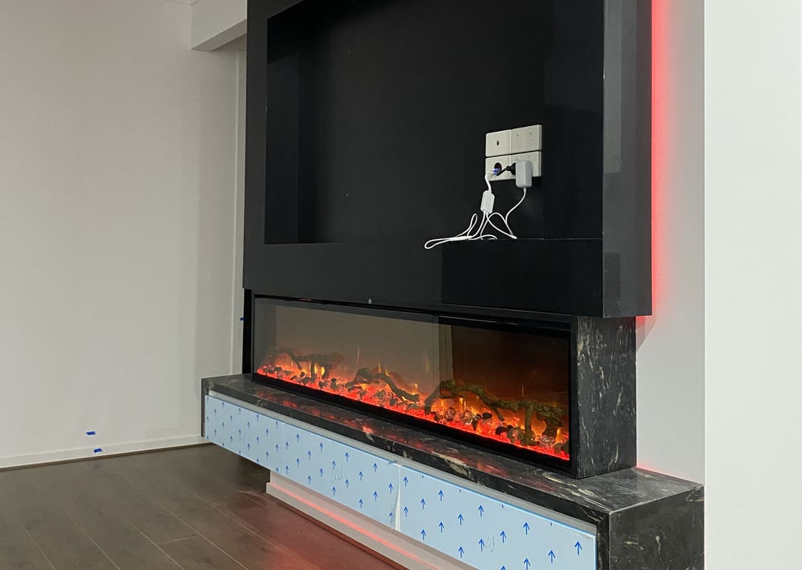 Custom TV frame and fireplace construction in Melbourne home